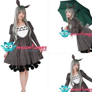 Totoro cosplay with dress, headpiece and tail.